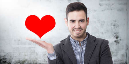 Portrait of adult man with heartの写真素材