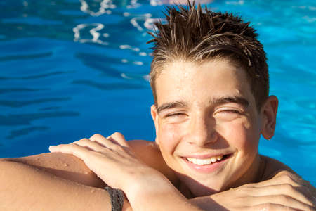 child in the pool in summerの写真素材