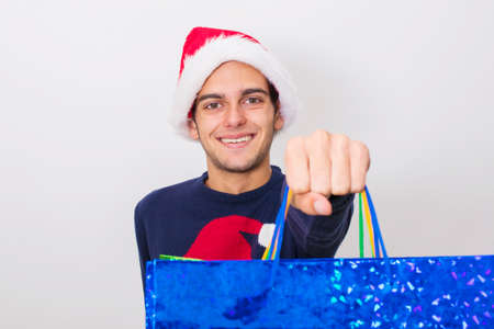 young isolated with christmas shoppingの写真素材