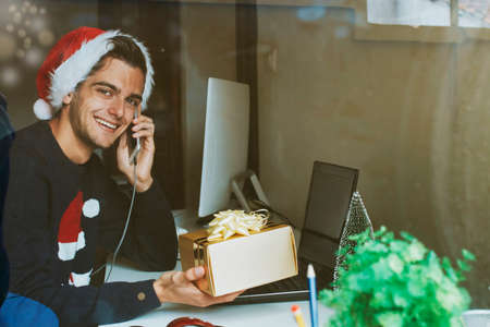 young at home or at the office working or studying at christmasの写真素材