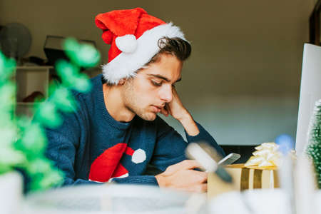 young at home or at the office working or studying at christmasの写真素材
