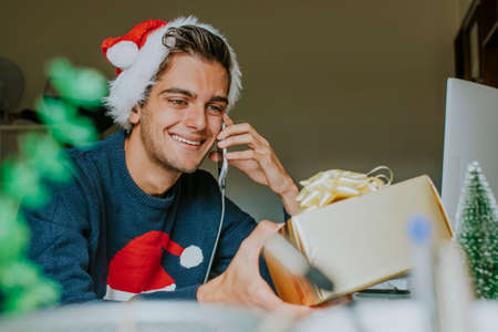 young at home or at the office working or studying at christmas