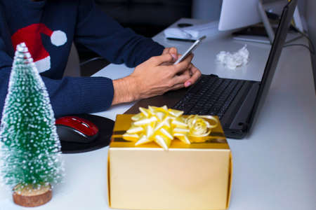 christmas gift box in office or home deskの写真素材
