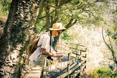 traveler with backpack and mapの写真素材