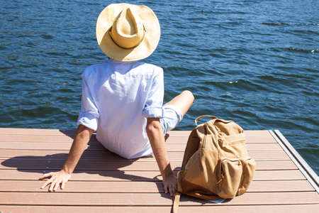 traveller with the backpack at the jettyの写真素材