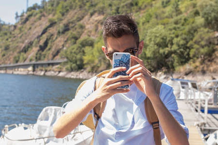 young travelling with the mobile phoneの写真素材