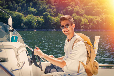 traveler navigating with the backpack and the mapの写真素材