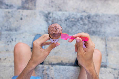 closeup hands with ice creamの写真素材
