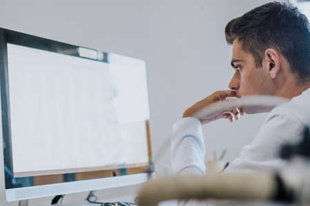 Young at home or in the office working with the computer or studying