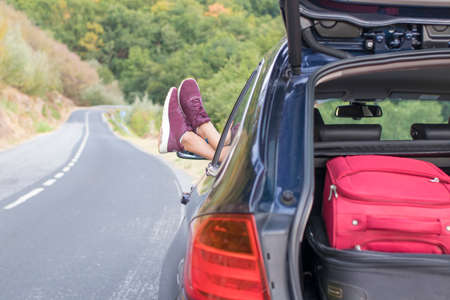 car with suitcases and driver restingの写真素材
