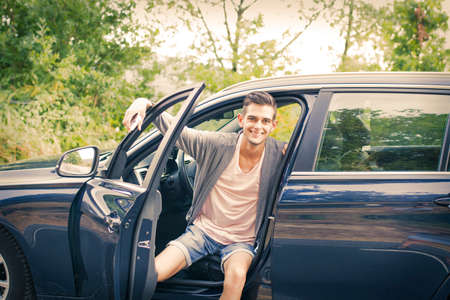 young man in the car