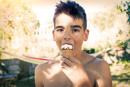 child portrait in summer eating ice creamの写真素材