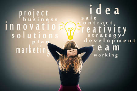 woman on her back with the lightbulb and creative conceptsの写真素材
