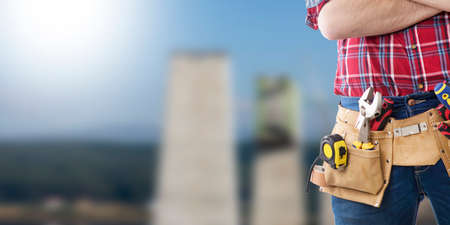 worker and professional builder with tools