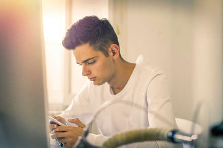 young person in front of the computer at home or in the officeの写真素材