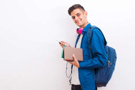 college adolescent student with mobile phone and books