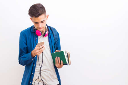 college adolescent student with mobile phone and books