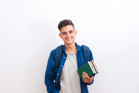 teenager college student with books on white backgroundの写真素材