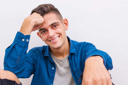 young casual style on the white wallの写真素材