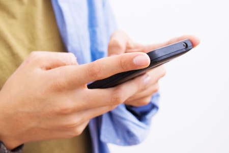teenager's hands with the mobile phone