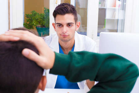 doctor with patient in consultationの写真素材