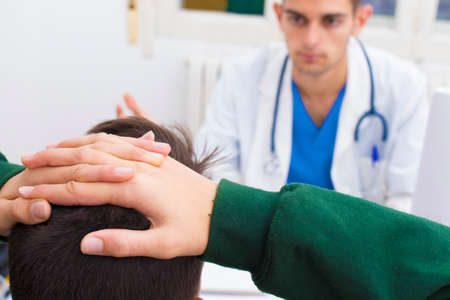 doctor with patient in consultationの写真素材