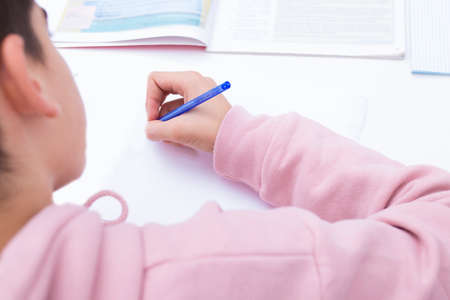 child student write on the home or school deskの写真素材