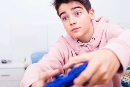 child playing with the joystick of the gameの写真素材