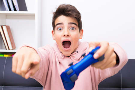 child with the joystick playing the game