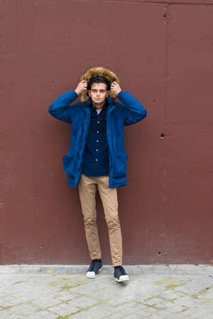 young fashioned on the wall of the city streetの写真素材