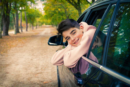 child travelling in the car windowの写真素材