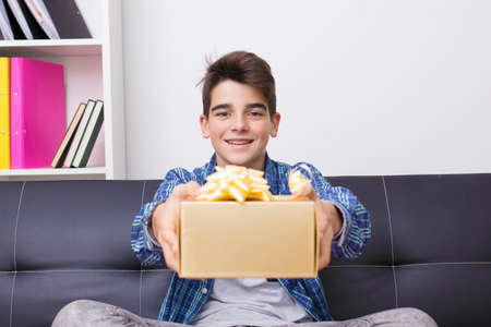 child, teenager or preteen with gift boxの写真素材
