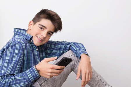 child, teenager or preteen with mobile phoneの写真素材