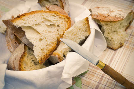 fresh cut bread from traditional wood-fired ovenの写真素材