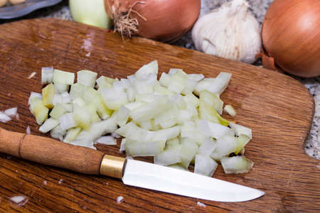 chopped onion for cooking in the wood tableの写真素材