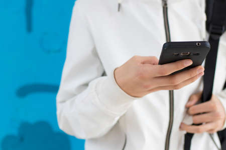 young hand with mobile phone