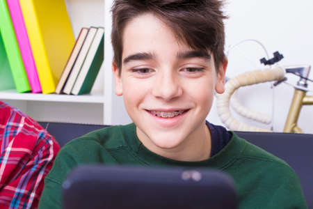 young teenager or preteen with mobile phone