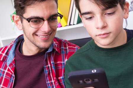 portraits of young people with mobile phoneの写真素材