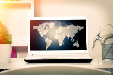 computer with international connections mapの写真素材