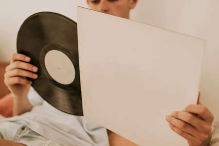 young at home with the vintage music albumの写真素材