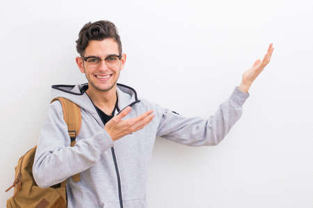 young smiling pointing the blank spaceの写真素材