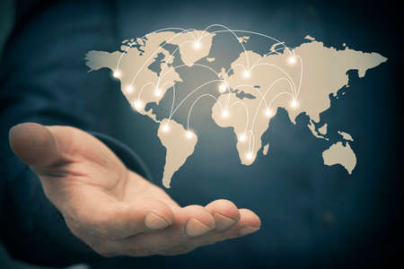 hand with the world map and connections