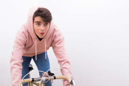 young in isolated bike on white backgroundの写真素材