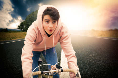 young man on bicycle doing sport
