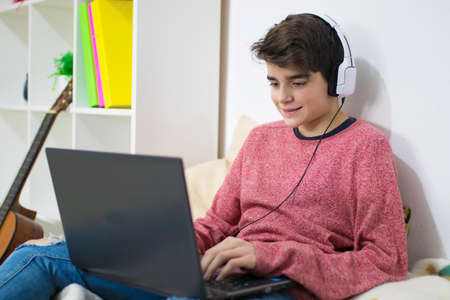 teenager or student working with the computer at homeの写真素材