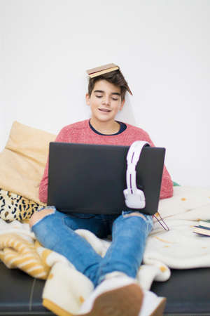 teenager or student working with the computer at homeの写真素材
