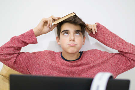 teenager or student working with the computer at homeの写真素材