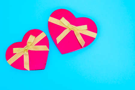 heart-shaped gift box in blue backgroundの写真素材