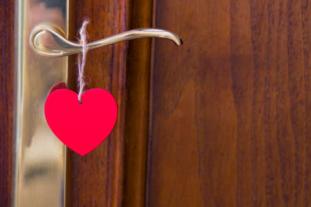 door with heart card hanging