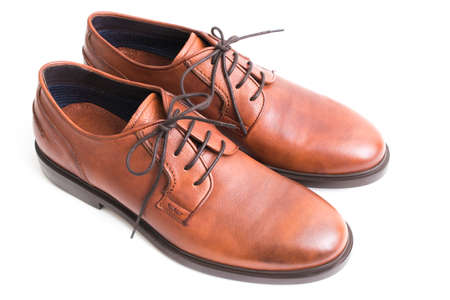 brown leather shoes insulated in white backgroundの写真素材
